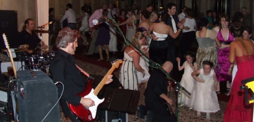Katsquire performing at a wedding party